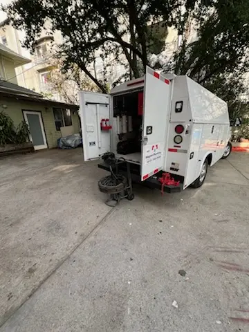 Magnet Plumbing service vehicle on-site for Grease Trap Cleaning in Christmas